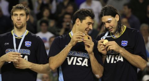 Argentina's Luis Scola, right, Carlos Delfino, center, and Andres Nocioni, left, don their gold medals during the ceremony honoring their 80-75 victory over Brazil in the FIBA Americas Championship final basketball game in Mar del Plata, Argentina, Sunday Sept. 11, 2011. (AP Photo/Martin Mejia)