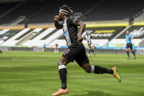 Newcastle's Allan Saint-Maximin celebrates after scoring during the English Premier League soccer match between Newcastle United and Sheffield United at St James' Park stadium in NewCastle, England, Sunday, June 21, 2020. (Michael Regan/Pool via AP)
