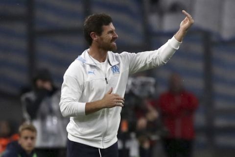 Marseille's head coach Andre Villas-Boas gives instructions to his players during the French League One soccer match between Marseille and Strasbourg at the Velodrome stadium in Marseille, southern France, Sunday, Oct. 20, 2019. (AP Photo/Daniel Cole)
