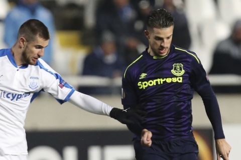 Apollon's Valentin Roberge, left, with Everton's Kevin Mirallas during the Europa League group E soccer match between Apollon Limassol and Everton at the GSP stadium, in Nicosia, Cyprus, on Thursday, Dec. 7, 2017. (AP Photo/Petros Karadjias)