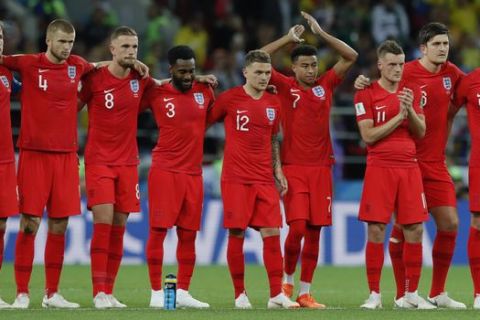 England's Harry Kane, right, goalkeeper Jordan Pickford, centre, and Kieran Trippier celebrate at the end of the round of 16 match between Colombia and England at the 2018 soccer World Cup in the Spartak Stadium, in Moscow, Russia, Tuesday, July 3, 2018. England won after a penalty shoot out. (AP Photo/Victor R. Caivano)