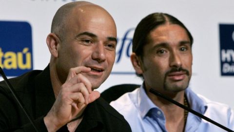 Former tennis player Andre Agassi, left, gestures as Chile's former tennis player Marcelo Rios looks on during a press conference in Santiago, Chile, Thursday, March 29, 2007. Agassi is in Chile for an exhibition game against Rios. (AP Photo/Santiago Llanquin)
