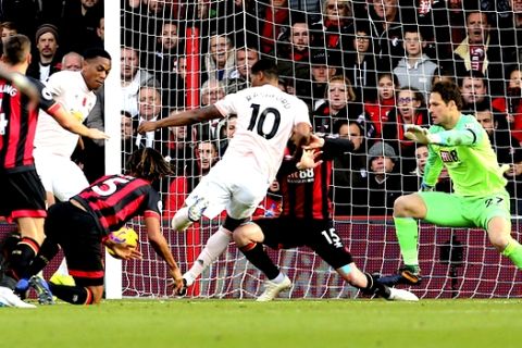 Manchester United's Marcus Rashford scores his side's second goal of the game during the English Premier League soccer match between Bournemouth and Manchester United at The Vitality Stadium, Bournemouth, England.Saturday Nov. 3, 2018. (Mark Kerton/PA via AP)