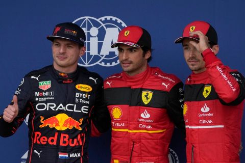 Ferrari driver Carlos Sainz of Spain, center, poses after setting a pole position with second placed Red Bull driver Max Verstappen of the Netherlands, left, and third placed Ferrari driver Charles Leclerc of Monaco during the qualifying session for the British Formula One Grand Prix at the Silverstone circuit, in Silverstone, England, Saturday, July 2, 2022. The British F1 Grand Prix is held on Sunday July 3, 2022. (AP Photo/Matt Dunham)