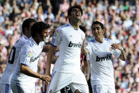Real Madrid's Kaka (C) celebrates his goal against Athletic Bilbao with his team mates Esteban Granero (L) and Angel Di Maria (R) during their Spanish first division soccer match at the San Mames stadium in Bilbao April 9, 2011. REUTERS/Felix Ordonez (SPAIN - Tags: SPORT SOCCER)