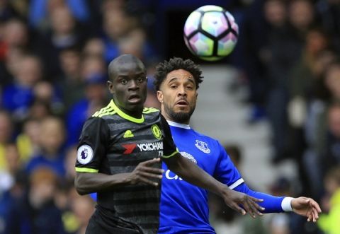 Chelsea's N'Golo Kante, foreground and Everton's Ashley Williams battle for the ball  during the English Premier League soccer match between Everton and Chelsea, at Goodison Park, in Liverpool, England, Sunday April 30, 2017. (Nigel French/ PA via AP)