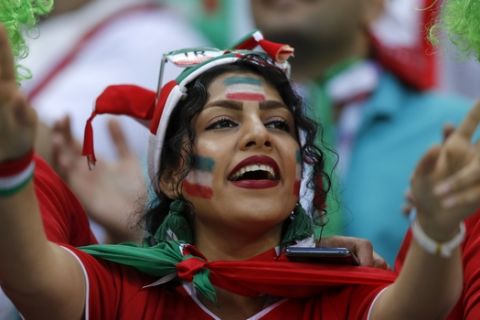 An Iranian fan cheers as she waits for the start of the group B match between Iran and Spain at the 2018 soccer World Cup in the Kazan Arena in Kazan, Russia, Wednesday, June 20, 2018. (AP Photo/Manu Fernandez)
