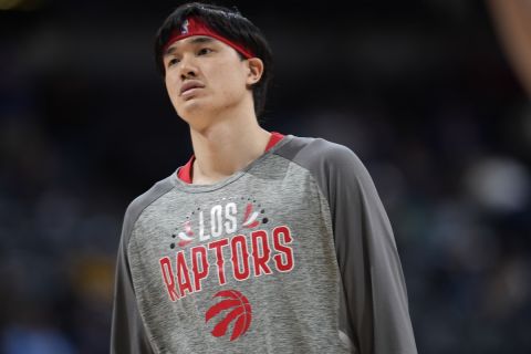 Toronto Raptors forward Yuta Watanabe (18) in the first half of an NBA basketball game Saturday, March 12, 2022, in Denver. (AP Photo/David Zalubowski)