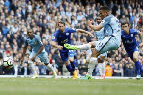 Manchester City's Gabriel Jesus scores his side's second goal of the game from the penalty spot, during the English Premier League soccer match between Manchester City and Leicester, at the Etihad Stadium, in Manchester, England, Saturday May 13, 2017. (Martin Rickett/PA via AP)