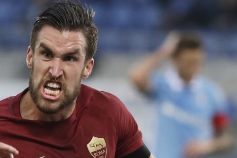 Roma's Kevin Strootman celebrates after scoring during a Serie A soccer match between Lazio and Roma, at the Rome Olympic stadium Sunday, Dec. 4, 2016. (AP Photo/Gregorio Borgia)