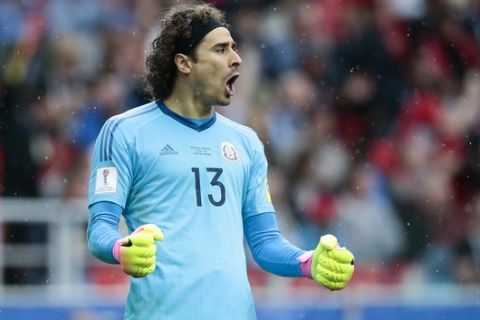 Mexico goalkeeper Guillermo Ochoa celebrates his side's first goal during the Confederations Cup, third place soccer match between Portugal and Mexico, at the Moscow Spartak Stadium, Sunday, July 2, 2017. (AP Photo/Denis Tyrin)
