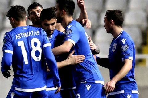 Cyprus' Kostas Laifis, center, celebrates his goal with teammates against San Marino during the Euro 2020 group I qualifying soccer match between Cyprus and San Marino at the GSP stadium in Nicosia, Cyprus, Thursday, March 21, 2019. (AP Photo/Petros Karadjias)