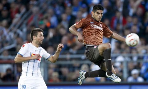 St. Pauli's Carlos Zambrano of Peru, right, and Hoffenheim's Vedad Ibisevic of Bosnia-Herzegovina challenge for the ball during the German first division Bundesliga soccer match between FC St. Pauli and 1899 Hoffenheim in the stadium in Hamburg, northern Germany, on Saturday, Aug. 28, 2010. Hoffenheim won by 0-1. (apn Photo/Axel Heimken) ** NO MOBILE USE UNTIL 2 HOURS AFTER THE MATCH, WEBSITE USERS ARE OBLIGED TO COMPLY WITH DFL-RESTRICTIONS, SEE INSTRUCTIONS FOR DETAILS ***