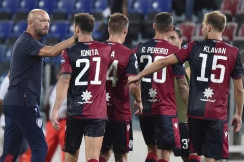 Cagliari head coach Walter Zenga and the team players celebrate at the end of the match during a Serie A soccer match between Cagliari and Juventus, at the Sardegna Arena stadium, in Cagliari, Italy, Wednesday, July 29, 2020. (Alessandro Tocco/LaPresse via AP)