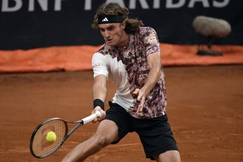 Stefanos Tsitsipas of Greece returns the ball to Nuno Borges of Portugal during their match at the Italian Open tennis tournament, in Rome, Saturday, May 13, 2023. (AP Photo/Antonietta Baldassarre)