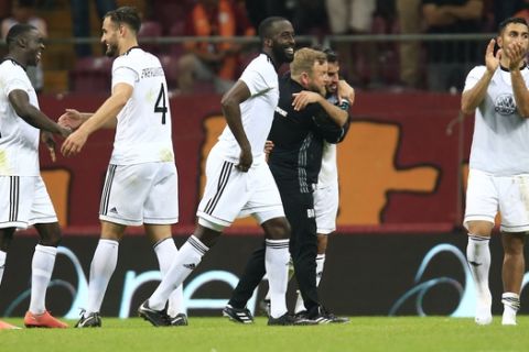 Ostersund's players and team members celebrate following an UEFA Europa League second qualifying round, soccer match against Galatasaray in Istanbul, Thursday, July 20, 2017. The match ended 1-1 draw, but Ostersund won 3-1 on aggregate. ( AP Photo/Lefteris Pitarakis)