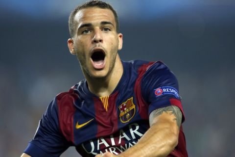 Barcelona's Sandro Ramirez celebrates after scoring his side's 3rd goal during the Champions League group F soccer match between F.C. Barcelona and Ajax at Camp Nou stadium in Barcelona, Spain, Tuesday, Oct. 21, 2014. Barcelona defeated Ajax 3-1. (AP Photo/Emilio Morenatti)