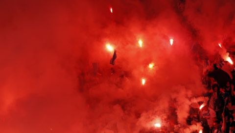 Soccer fans burn flares before the Europa League Final soccer match between Marseille and Atletico Madrid at the Stade de Lyon outside Lyon, France, Wednesday, May 16, 2018. (AP Photo/Christophe Ena)