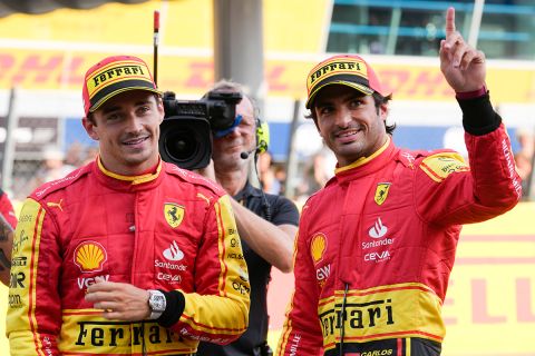 Ferrari driver Carlos Sainz of Spain, right, celebrates his pole position with third placed Ferrari driver Charles Leclerc of Monaco after the qualifying session ahead of Sunday's Formula One Italian Grand Prix auto race, at the Monza racetrack, in Monza, Italy, Saturday, Sept. 2, 2023. (AP Photo/Luca Bruno)