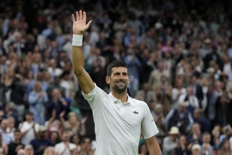 Serbia's Novak Djokovic reacts after beating Italy's Jannik Sinner to win their men's singles semifinal match on day twelve of the Wimbledon tennis championships in London, Friday, July 14, 2023. (AP Photo/Alastair Grant)
