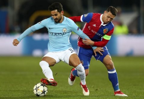 BASEL, BASEL-STADT - FEBRUARY 13: Ilkay Gundogan of Manchester City is challenged by Marek Suchy of FC Basel during the UEFA Champions League Round of 16 First Leg  match between FC Basel and Manchester City at St. Jakob-Park on February 13, 2018 in Basel, Switzerland.  (Photo by Catherine Ivill/Getty Images)