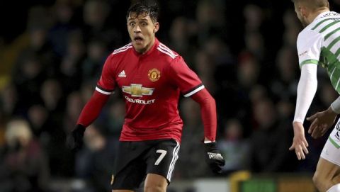 Manchester United's Alexis Sanchez, centre, controls the ball,  during the FA Cup, fourth round soccer match between Yeovil Town and Manchester United at Huish Park, in Yeovil, England, Friday Jan. 26, 2018. (Nick Potts/PA via AP)