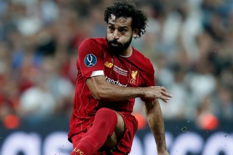 Liverpool's Mohamed Salah passes the ball during the UEFA Super Cup soccer match between Liverpool and Chelsea, in Besiktas Park, in Istanbul, Wednesday, Aug. 14, 2019.(AP Photo/Thanassis Stavrakis)