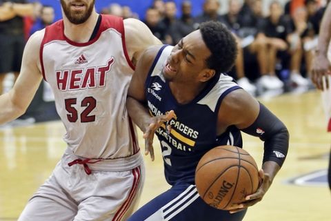 Indiana Pacers' Jordan Loyd (2) makes a move to the basket against Miami Heat's Jake Odum (52) during the first half of an NBA summer league basketball game, Monday, July 3, 2017, in Orlando, Fla. (AP Photo/John Raoux)