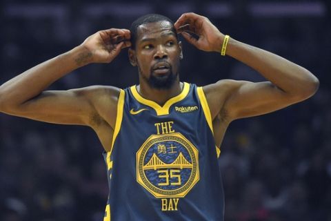 Golden State Warriors forward Kevin Durant gestures during a break in the game during the first half of an NBA basketball game against the Los Angeles Clippers Monday, Nov. 12, 2018, in Los Angeles. (AP Photo/Mark J. Terrill)