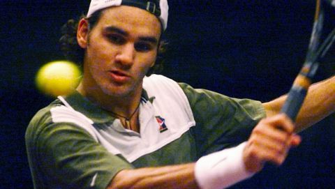 Swiss Roger Federer returns the ball to Great Britain's Greg Rusedski during their semifinal match of the ATP tennis tournament in Vienna, Saturday, Oct. 16 1999. Rusedski defeated Federer with 6-3, 6-4. (AP Photo/Rudi Blaha)
