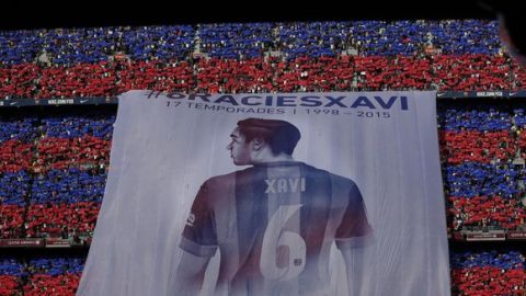 A giant banner of FC Barcelona Xavi Hernandez is displayed prior to the Spanish La Liga soccer match between FC Barcelona and Deportivo Coruna at the Camp Nou stadium in Barcelona, Spain, Saturday, May 23, 2015. Barcelona midfielder Xavi Hernandez says he will leave the Catalan club after 17 trophy-laden seasons in which he set club records for appearances and titles won. The 35-year-old Xavi, who has played 764 matches for Barcelona, says he will cut his contract short by one year and leave after this season to go play for Qatari club Al-Sadd on a two-year contract. (ANSA/AP Photo/Manu Fernandez)