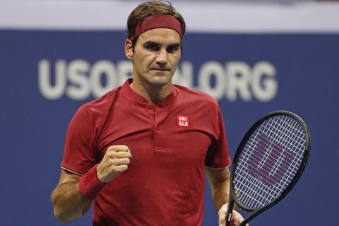 Roger Federer, of Switzerland, celebrates after defeating Yoshihito Nishioka, of Japan, during the first round of the U.S. Open tennis tournament, Tuesday, Aug. 28, 2018, in New York. (AP Photo/Adam Hunger)