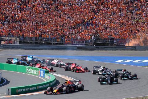 Red Bull driver Max Verstappen of the Netherlands leads at the start and followed by Mercedes driver Lewis Hamilton of Britain and Mercedes driver Valtteri Bottas of Finland during the Formula One Dutch Grand Prix, at the Zandvoort racetrack, Netherlands, Sunday, Sept. 5, 2021. (AP Photo/Peter Dejong)