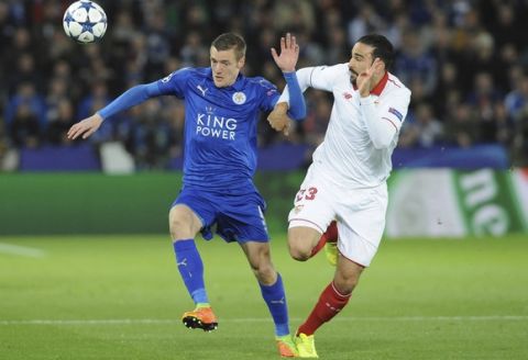 Leicester's Jamie Vardy, left, competes for the ball with Sevilla's Adil Rami during the Champions League round of 16 second leg soccer match between Leicester City and Sevilla at the King Power Stadium in Leicester, England, Tuesday, March 14, 2017. (AP Photo/Rui Vieira)