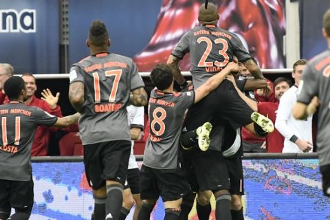 Team FC Bayern Munich celebrate after scoring a goal during the German first division Bundesliga soccer match between RB Leipzig and FC Bayern Munich in Leipzig, Germany, Saturday, May 13, 2017. Munich won by 5-4 .(AP Photo/Jens Meyer)