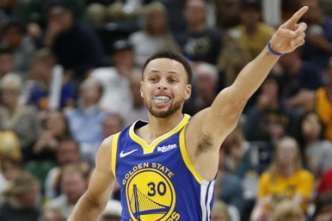 Golden State Warriors guard Stephen Curry (30) runs up court after scoring against the Utah Jazz in the second half during an NBA basketball game Friday, Oct. 19, 2018, in Salt Lake City. (AP Photo/Rick Bowmer)