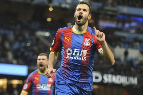 Crystal Palace's Luka Milivojevic celebrates after scoring his side's third goal during the English Premier League soccer match between Manchester City and Crystal Palace at Etihad stadium in Manchester, England, Saturday, Dec. 22, 2018. (AP Photo/Rui Vieira)