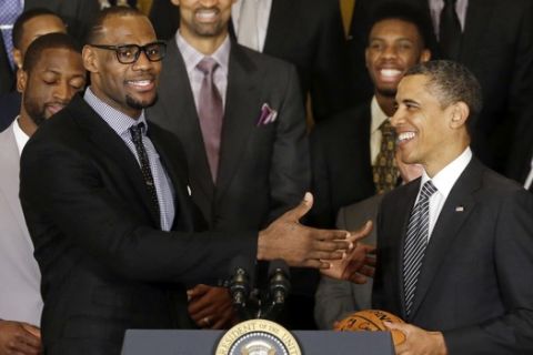 LeBron James speaks after presenting President Barack Obama with a basketball signed by the NBA champions Miami Heat basketball team in the East Room at the White House in Washington, Monday, Jan. 28, 2013. (AP Photo/Charles Dharapak)