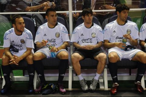 Argentinian Lionel Messi (3-R) and teammates watch the friendly game between Argentina and Costa Rica  at the National Stadium  in San Jose on March 29 , 2011. The match ended 0-0. AFP PHOTO/ Yuri CORTEZ (Photo credit should read YURI CORTEZ/AFP/Getty Images)