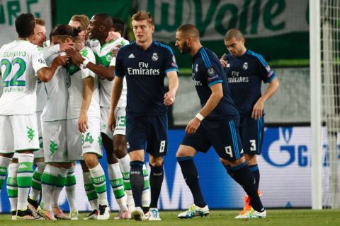 "Wolfsburg's Swiss defender Ricardo Rodriguez (C) celebrates scoring from the penalty spot with his team-mates during the UEFA Champions League quarter-final, first-leg football match between VfL Wolfsburg and Real Madrid on April 6, 2016 in Wolfsburg, northern Germany.  / AFP / ODD ANDERSEN        (Photo credit should read ODD ANDERSEN/AFP/Getty Images)"