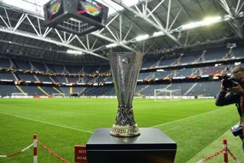 The Europa League trophy is on display on the pitch at the Friends Arena in Stockholm, Sweden, Tuesday, May 23, 2017. Ajax Amsterdam and Manchester United will play the soccer Europa League final in Stockholm on Wednesday, May 24. (AP Photo/Martin Meissner)