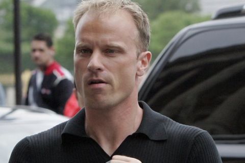 Arsenal's Dennis Bergkamp arrives at his hotel in Paris,Tuesday, May, 16, 2006. The Champions League final soccer match between Arsenal and Barcelona takes place Wednesday at the Stade de France stadium, outside Paris. (AP Photo/Christophe Ena) 