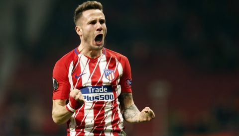 Atletico Madrid's Saul Niguez celebrates after scoring his side's opening goal during the Europa League Round of 16 first leg soccer match between Atletico Madrid and Lokomotiv Moscow at the Metropolitano stadium in Madrid, Thursday, March 8, 2018. (AP Photo/Francisco Seco)