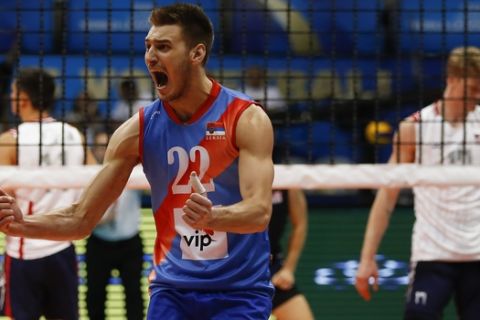 Serbia's Aleksandar Okolic celebrates his team's victory over the U.S. after a Volleyball World League semifinal game at the Maracanazinho gymnasium in Rio de Janeiro, Brazil, Saturday, July 18, 2015. Serbia won 3-2 and is qualified to the finals. (AP Photo/Leo Correa)
