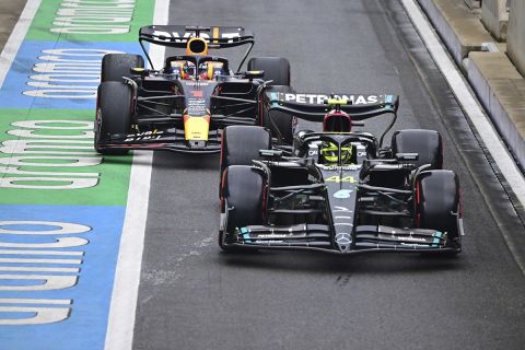 Mercedes driver Lewis Hamilton of Britain, right, and Red Bull driver Max Verstappen of the Netherlands steers his cars before the qualifying session at the British Formula One Grand Prix at the Silverstone racetrack, Silverstone, England, Saturday, July 8, 2023. The British Formula One Grand Prix will be held on Sunday. (Christian Bruna/Pool photo via AP)
