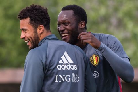 Belgian national soccer players Moussa Dembele, left, and Romelu Lukaku smile during a training of the Belgian national soccer team in Knokke, Belgium, on Thursday May 19, 2016. (AP Photo/Geert Vanden Wijngaert)