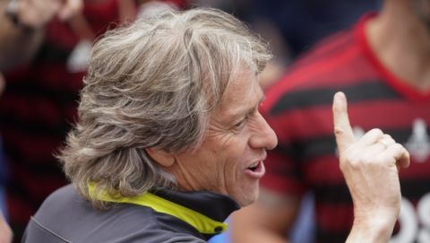 Jorge Jesus, coach of Brazil's Flamengo parades with the team at their arrival in Rio de Janeiro, Brazil, Sunday, Nov. 24, 2019. Flamengo overcame Argentina's River Plate 2-1 in the Copa Libertadores final match on Saturday in Lima to win its second South American title. (AP Photo/Ricardo Borges)