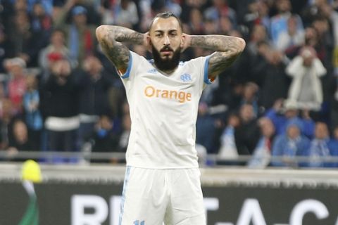 Marseille's Konstantinos Mitroglou, left, reacts as Atletico's Angel Correa looks on during the Europa League Final soccer match between Marseille and Atletico Madrid at the Stade de Lyon in Decines, outside Lyon, France, Wednesday, May 16, 2018. (AP Photo/Thibault Camus)