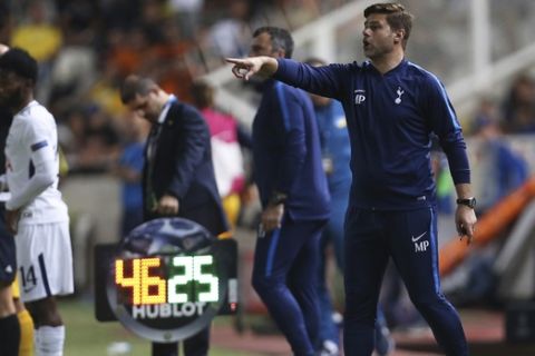 Tottenham coach Mauricio Pochettino gives instructions to his player during the Champions League Group H soccer match between APOEL Nicosia and Tottenham Hotspur at GSP stadium, in Nicosia, Cyprus, on Tuesday, Sept. 26, 2017. (AP Photo/Petros Karadjias)
