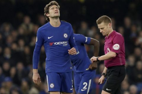 Chelsea's Marcos Alonso reacts after failing to score a freekick in the final minutes of the English Premier League soccer match between Chelsea and Leicester City at Stamford Bridge stadium in London, Saturday, Jan. 13, 2018. (AP Photo/Matt Dunham)